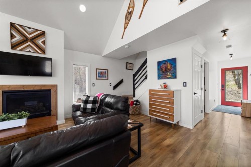 62 Sands Street, Rochon Sands, AB - Indoor Photo Showing Living Room With Fireplace