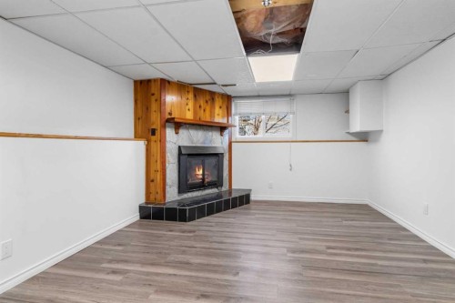 39 Cedar Crescent, Lacombe, AB - Indoor With Fireplace