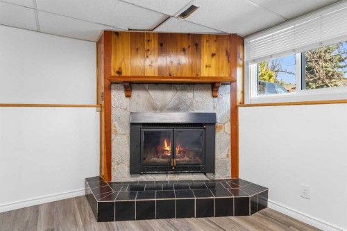39 Cedar Crescent, Lacombe, AB - Indoor Photo Showing Living Room With Fireplace