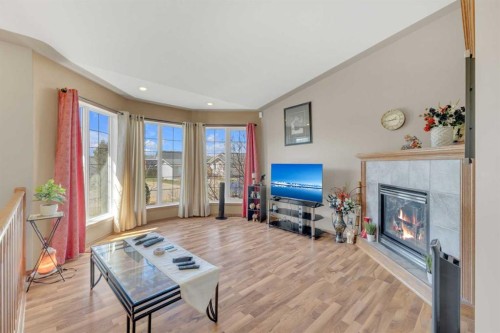 19 Heenan Crescent, Sylvan Lake, AB - Indoor Photo Showing Living Room With Fireplace