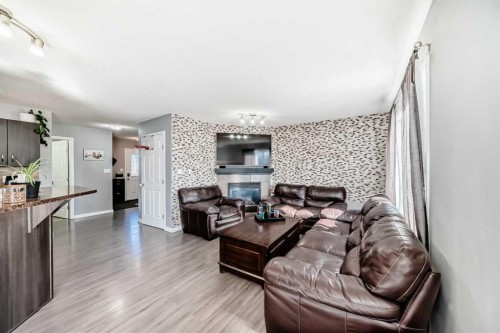 227 Avena Circle, Leduc, AB - Indoor Photo Showing Living Room With Fireplace