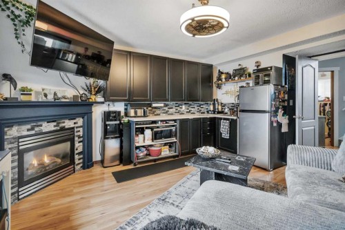 17 Keast Way, Red Deer, AB - Indoor Photo Showing Living Room With Fireplace