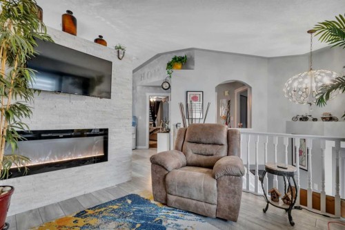 17 Keast Way, Red Deer, AB - Indoor Photo Showing Living Room With Fireplace