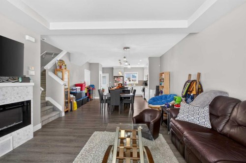 994 Berg Place, Leduc, AB - Indoor Photo Showing Living Room With Fireplace