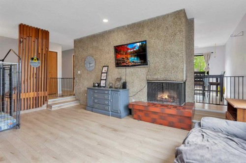 23 Newcombe Crescent, Red Deer, AB - Indoor Photo Showing Living Room With Fireplace