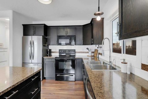 14 Cedar Square, Blackfalds, AB - Indoor Photo Showing Kitchen With Double Sink