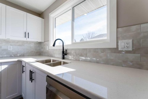 25 Osborne Street, Red Deer, AB - Indoor Photo Showing Kitchen With Double Sink With Upgraded Kitchen