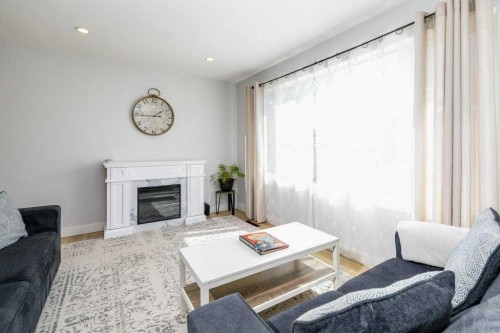 2 Scott Street, Red Deer, AB - Indoor Photo Showing Living Room With Fireplace