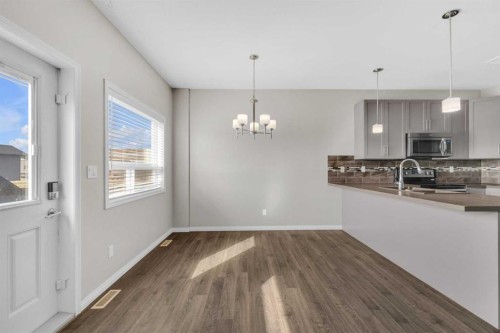 149 Hawkridge Boulevard, Penhold, AB - Indoor Photo Showing Kitchen