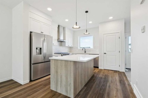 49 Bluerock Hill Sw, Calgary, AB - Indoor Photo Showing Kitchen With Upgraded Kitchen