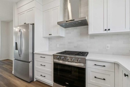 49 Bluerock Hill Sw, Calgary, AB - Indoor Photo Showing Kitchen With Upgraded Kitchen