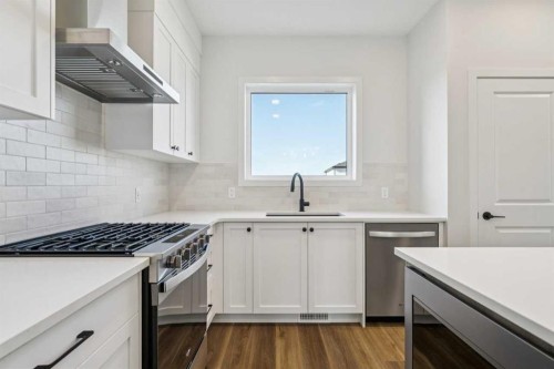 49 Bluerock Hill Sw, Calgary, AB - Indoor Photo Showing Kitchen With Upgraded Kitchen