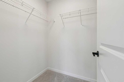 49 Bluerock Hill Sw, Calgary, AB - Indoor With Storage