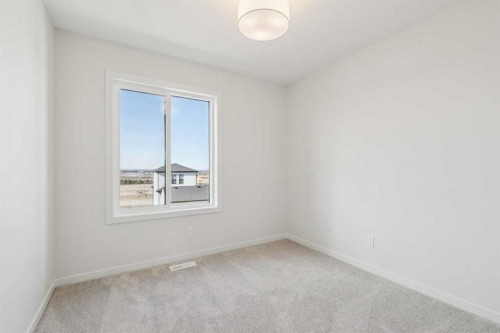 49 Bluerock Hill Sw, Calgary, AB - Indoor Photo Showing Other Room