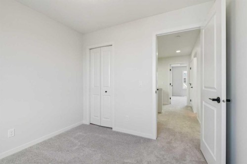 49 Bluerock Hill Sw, Calgary, AB - Indoor Photo Showing Other Room