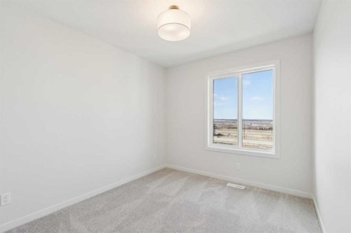 49 Bluerock Hill Sw, Calgary, AB - Indoor Photo Showing Other Room