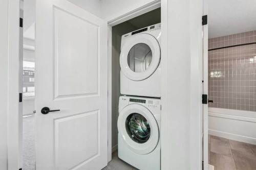 49 Bluerock Hill Sw, Calgary, AB - Indoor Photo Showing Laundry Room