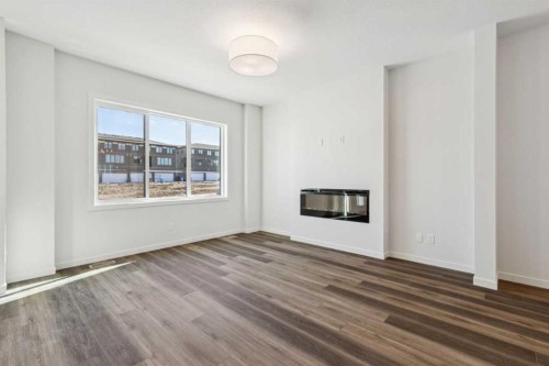 49 Bluerock Hill Sw, Calgary, AB - Indoor With Fireplace