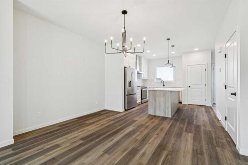 49 Bluerock Hill Sw, Calgary, AB - Indoor Photo Showing Kitchen With Upgraded Kitchen