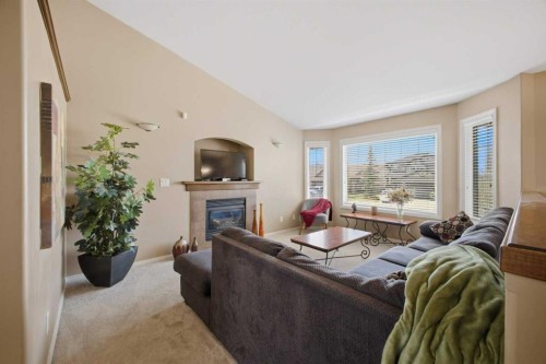 135 Issard Close, Red Deer, AB - Indoor Photo Showing Living Room With Fireplace