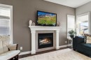 59 Reynolds Road, Sylvan Lake, AB  - Indoor Photo Showing Living Room With Fireplace 