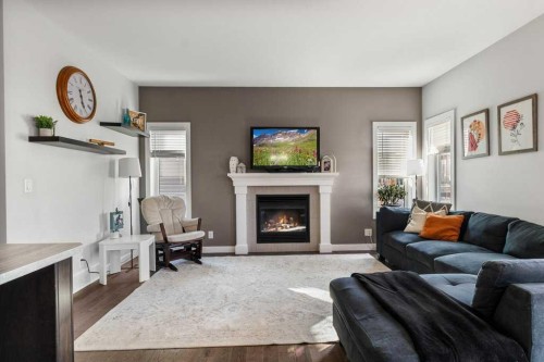 59 Reynolds Road, Sylvan Lake, AB - Indoor Photo Showing Living Room With Fireplace