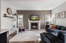 59 Reynolds Road, Sylvan Lake, AB  - Indoor Photo Showing Living Room With Fireplace 
