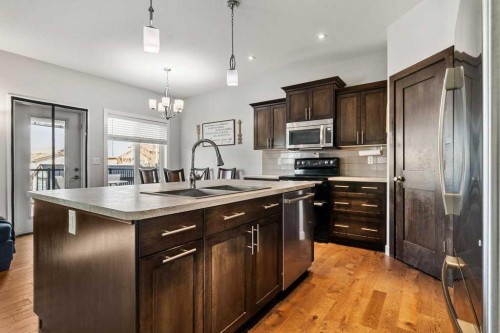 59 Reynolds Road, Sylvan Lake, AB - Indoor Photo Showing Kitchen With Double Sink With Upgraded Kitchen