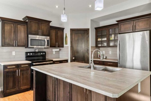 59 Reynolds Road, Sylvan Lake, AB - Indoor Photo Showing Kitchen With Stainless Steel Kitchen With Double Sink With Upgraded Kitchen