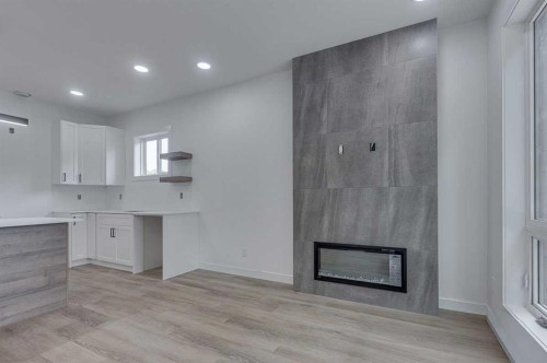 2-5537 51 Avenue, Lacombe, AB - Indoor With Fireplace