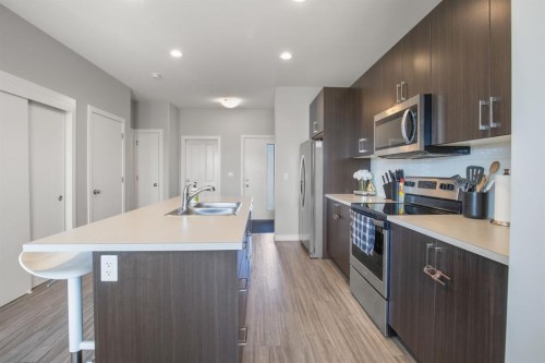 95 Palmer Circle, Blackfalds, AB - Indoor Photo Showing Kitchen With Double Sink With Upgraded Kitchen