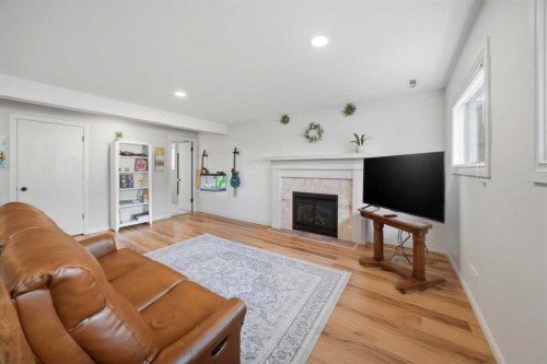 25 Gilbert Crescent, Red Deer, AB - Indoor Photo Showing Living Room With Fireplace