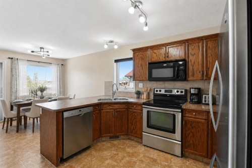 84 Vickers Close, Red Deer, AB - Indoor Photo Showing Kitchen With Stainless Steel Kitchen With Double Sink