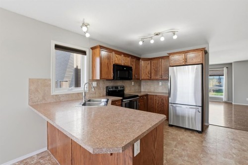84 Vickers Close, Red Deer, AB - Indoor Photo Showing Kitchen With Double Sink