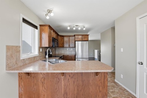 84 Vickers Close, Red Deer, AB - Indoor Photo Showing Kitchen With Double Sink