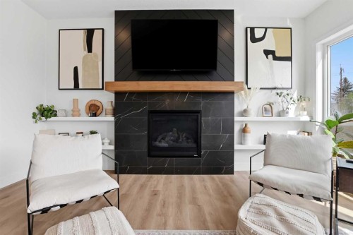 223 Ellington Crescent, Red Deer, AB - Indoor Photo Showing Living Room With Fireplace