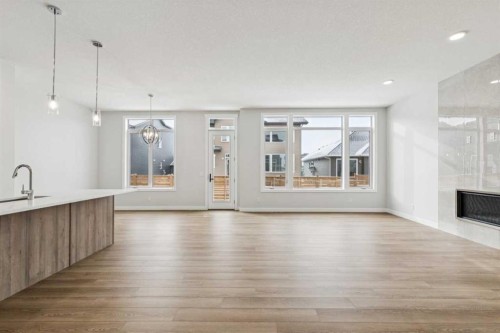 261 Dawson Wharf Crescent, Chestermere, AB - Indoor Photo Showing Other Room With Fireplace