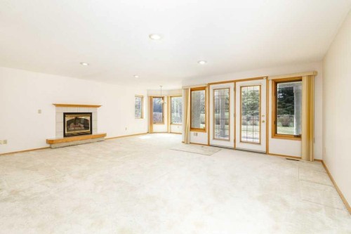 11-4700 Fountain Drive, Red Deer, AB - Indoor With Fireplace