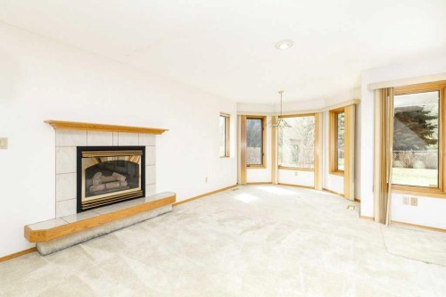 11-4700 Fountain Drive, Red Deer, AB - Indoor Photo Showing Living Room With Fireplace