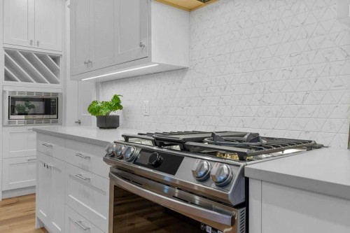 182 Slopeside Drive, Rural Lacombe County, AB - Indoor Photo Showing Kitchen With Upgraded Kitchen