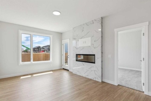 73 Southborough Square, Cochrane, AB - Indoor Photo Showing Living Room With Fireplace