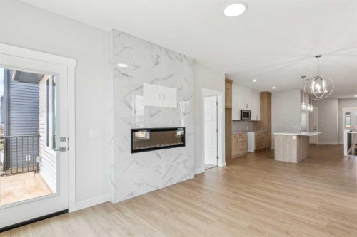 73 Southborough Square, Cochrane, AB - Indoor Photo Showing Living Room With Fireplace