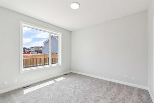 73 Southborough Square, Cochrane, AB - Indoor Photo Showing Other Room
