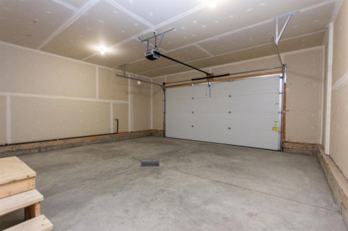 224 Augustus Way, Penhold, AB - Indoor Photo Showing Garage