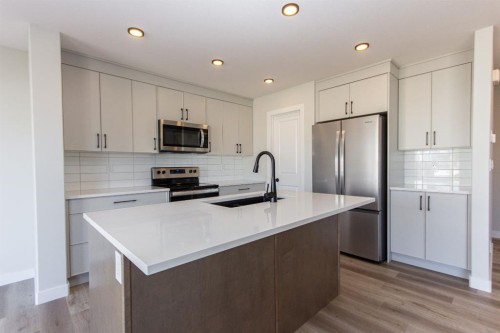 224 Augustus Way, Penhold, AB - Indoor Photo Showing Kitchen With Stainless Steel Kitchen With Upgraded Kitchen