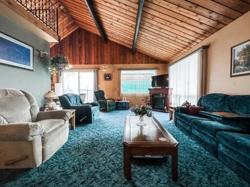 41 Sands Street, Rochon Sands, AB - Indoor Photo Showing Living Room With Fireplace