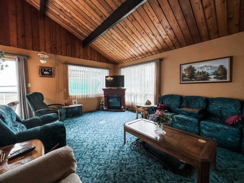 41 Sands Street, Rochon Sands, AB - Indoor Photo Showing Living Room With Fireplace