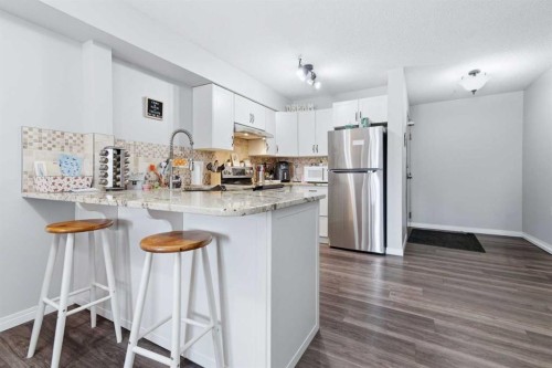 223A-80 Kelloway Crescent, Red Deer, AB - Indoor Photo Showing Kitchen With Upgraded Kitchen