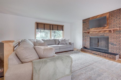 8 Nielsen Close, Red Deer, AB - Indoor Photo Showing Living Room With Fireplace