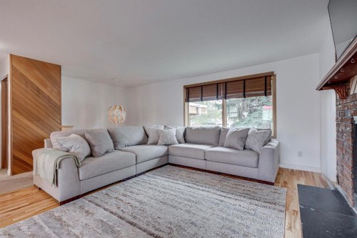 8 Nielsen Close, Red Deer, AB - Indoor Photo Showing Living Room With Fireplace
